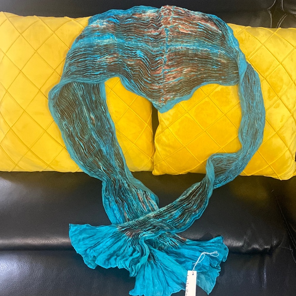 I am selling a beautiful brand new Loila Rowe turquoise crimped silk scarf.